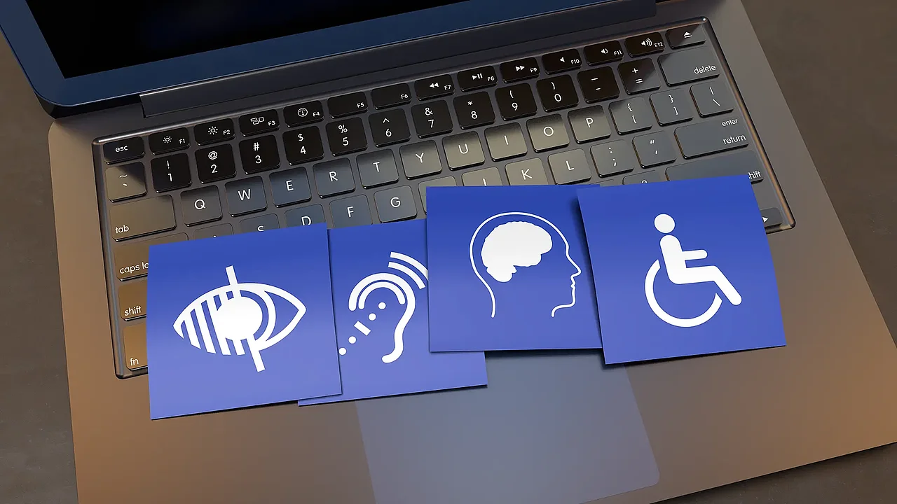 Symbolbild mit Laptop und Icons zum Thema Barrierefreiheit im Webdesign